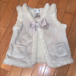 Beige faux fur vest with bow